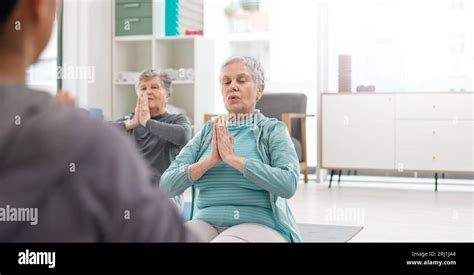 Old people in yoga class, fitness and meditation with breathing ...