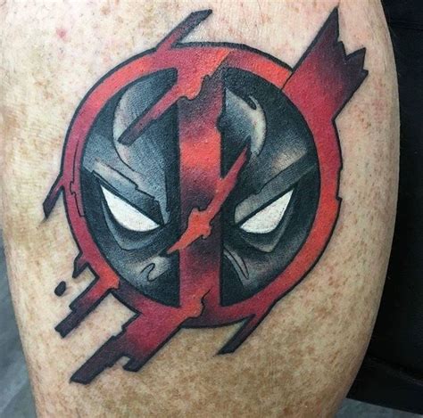 a deadpool tattoo on the back of a man's leg with red and black ink