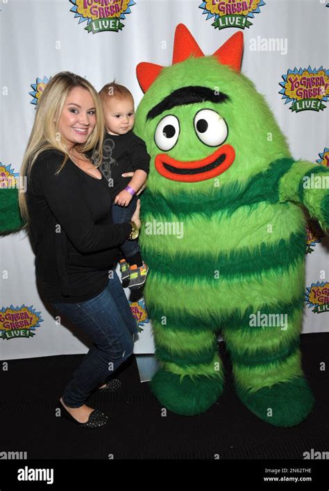 Tiffany Thornton Left And Son Kenneth Carney Are Seen At A Very