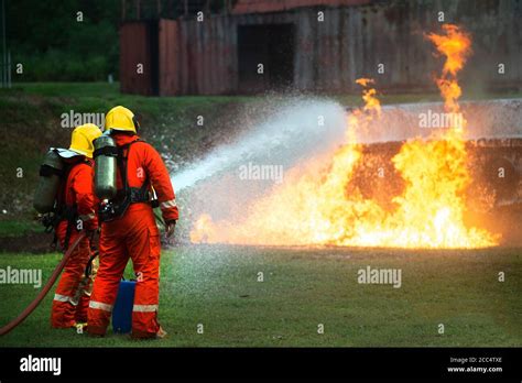 Hose Spraying Water On A Fire Hi Res Stock Photography And Images Alamy