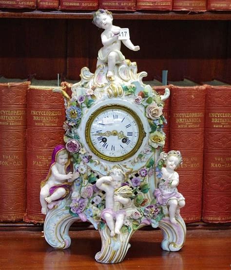 Good European Porcelain Mantle Clock Encased With Four Cherubs… Ceramics Glass Furniture