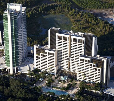 an aerial view of two large buildings in the city