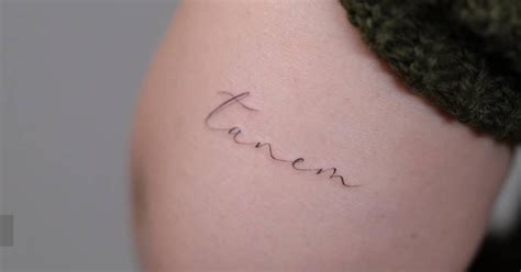 Tanem Lettering Tattoo Located On The Tricep