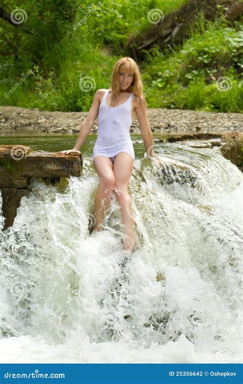 A Girl In A White T Shirt In A Waterfall Stock Photo Image Of