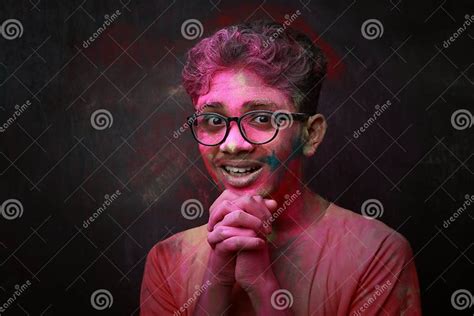 Portrait Of A Happy Smiling Boy With His Face Smeared With Colours