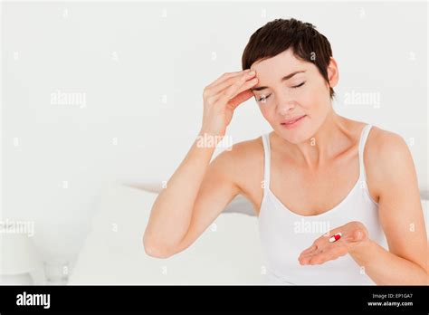 Cute Brunette Having A Headache Stock Photo Alamy