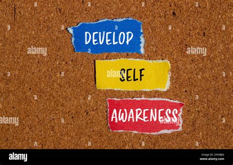 Develop Self Awareness Words Written On Ripped Paper Pieces With Brown