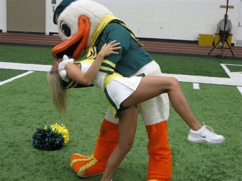 Oregon Ducks Cheerleader And Mascot Kissing We Love Our Ducks