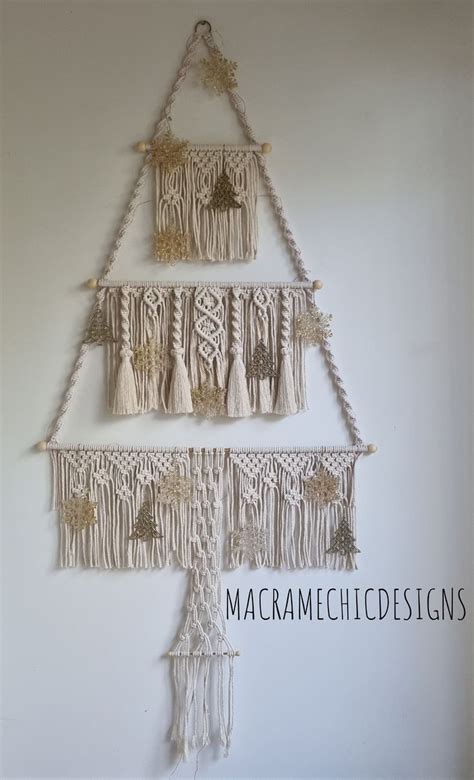 A Macrame Christmas Tree Hanging On The Wall