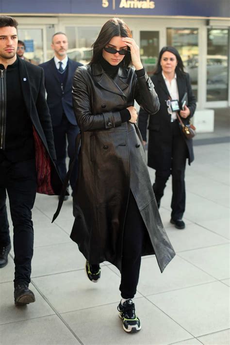 Kendall Jenner In A Black Leather Trench Coat Arrives In Milan