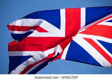 Waving Union Jack Flag On Blue Stock Photo 1978217297 | Shutterstock