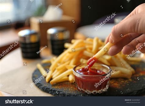 Woman Dipping French Fries Into Red Stock Photo 1622929027 | Shutterstock