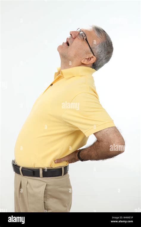 Man suffering from lower back pain Stock Photo - Alamy