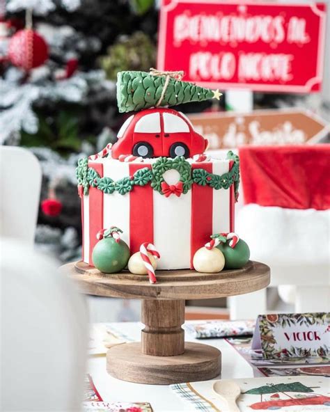 A Decorated Christmas Cake Sitting On Top Of A Table