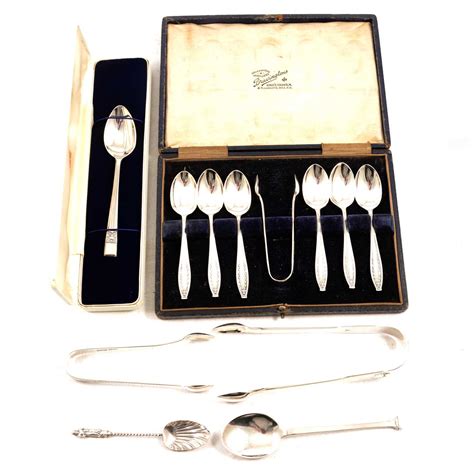 Lot 246 - A cased set of silver teaspoons, sugar tongs