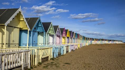 Relax On This Hidden Gem English Island With Pretty Pastel Huts And