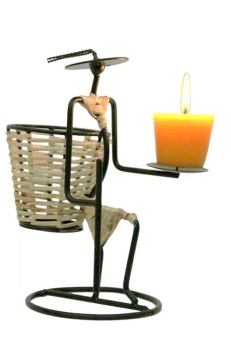 A Candle Holder With A Basket On It