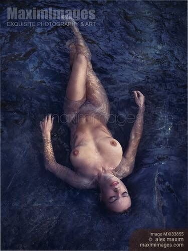 Photo Of Beautiful Nude Woman Lying In Dark Water Relaxed With Closed Eyes View From Above