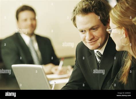 Three People At A Business Meeting Stock Photo Alamy