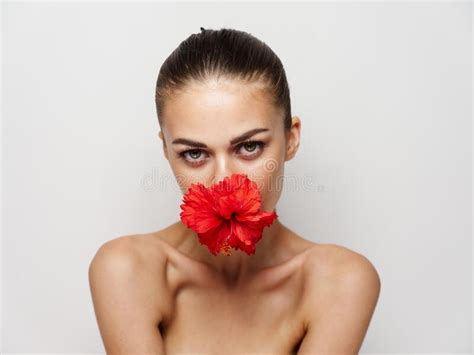 Attractive Woman Naked Shoulders Red Flower Cosmetics Closeup Stock