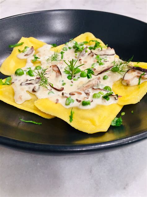 Mushroom Ravioli In A Parmigiano Reggiano Sauce