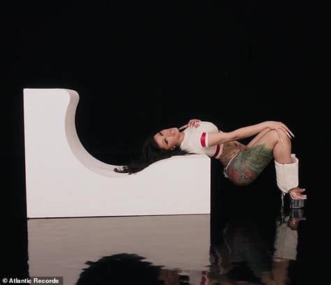 Cardi B Proudly Puts Her Ample Assets On Display In Five Very Skimpy