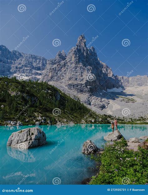 Couple Of Men And Women Visiting Lago Di Sorapis In The Italian