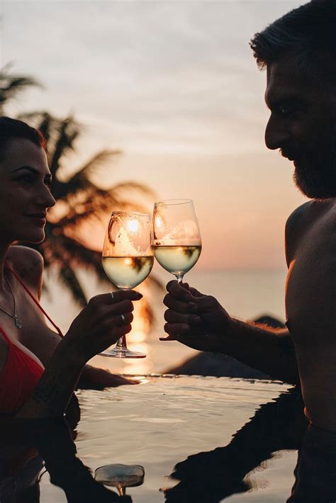 Couple enjoying a romantic sunset | Premium Photo - rawpixel