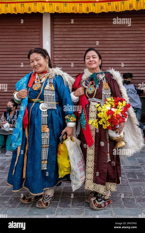 Two women in traditional dress wait for the Dalai Lama in Let, Ladakh ...