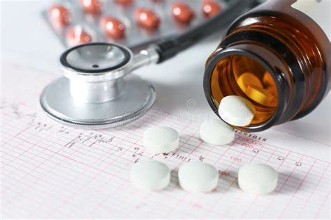 Stethoscope Pills Vials In Medical Room On Blue Background Top View