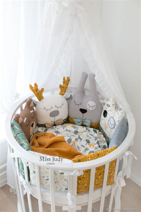 a white crib with stuffed animals in it
