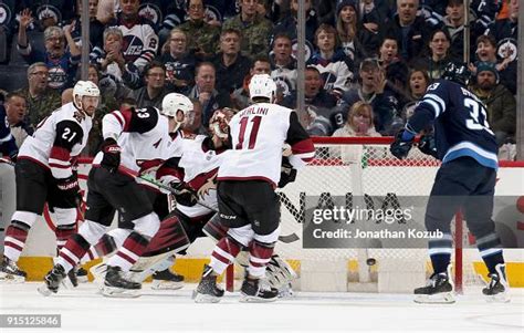 Dustin Byfuglien Of The Winnipeg Jets Bats The Puck Into The Open Net