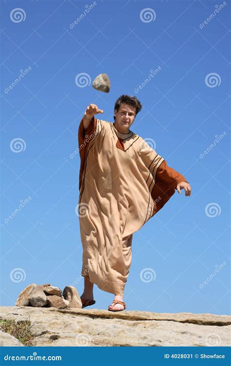 Ancient Man Throwing Stone Stock Image - Image: 4028031