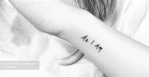 "As I Am" lettering tattoo located on the wrist.