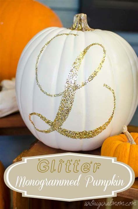 A White Pumpkin Decorated With Gold Glitter Monogrammed Pumpkins On A