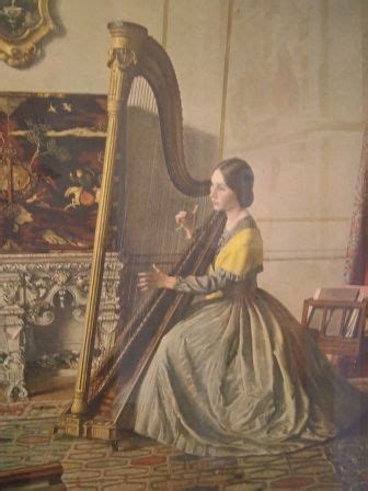 An Old Photo Of A Woman Playing A Harp In A Room With Paintings On The Wall