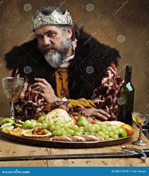 Its Lonely At The Top A Mature King Feasting Alone In A Banquet Hall Stock Photo Image Of