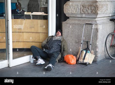 Homeless Man Sleeping Rough Outside Waterloo Station London Stock