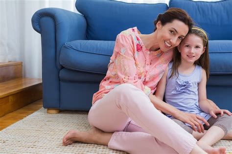 Premium Photo Mother And Daughter Smiling At Camera