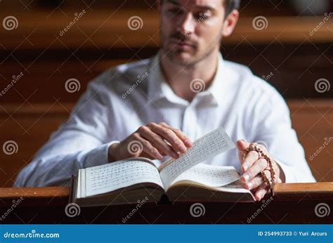 Theres A Reason Why Its A Bestseller A Young Man Reading The Bible In