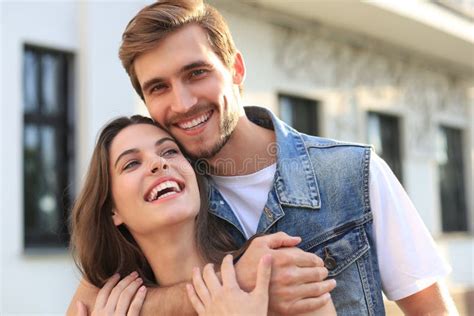 Beautiful Young Couple In Love Walking Outdoors At The City Street Hugging Stock Image Image