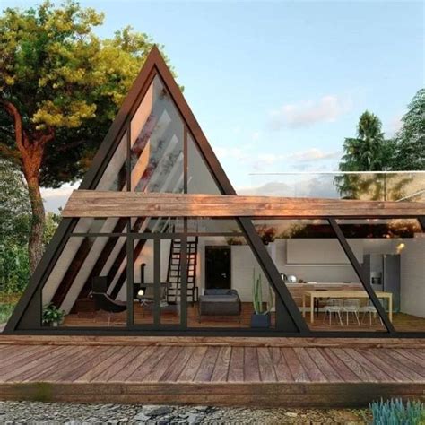 A Frame House With Wooden Deck And Glass Walls