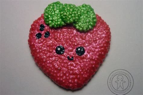 A Close Up Of A Strawberry With A Green Leaf On It