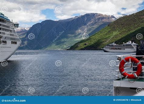 White Ships Sailing Between The Rocky Mountains In Narrow Fjord