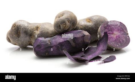 Peeled Vitelotte Potatoes With Rind Isolated On White Background Purple