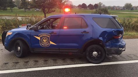 Michigan State Police trooper struck sitting in patrol SUV