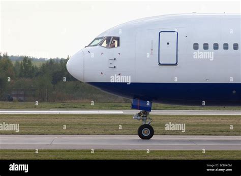 Airplane On The Runway Is Getting Ready To Take Off Close Up Side