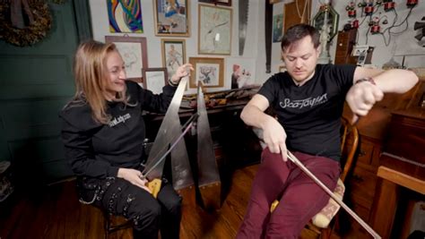 A Guitarist And The Saw Lady Switch Instruments For A Metallica Duet