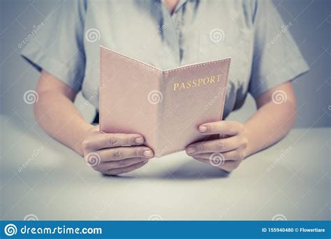 Immigration Woman Hand Holding Two Passports Isolated On White