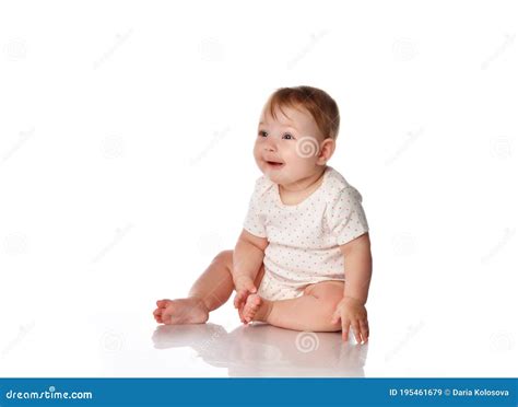 Cute Surprised Baby Girl Sitting On Studio Floor Stock Image Image Of